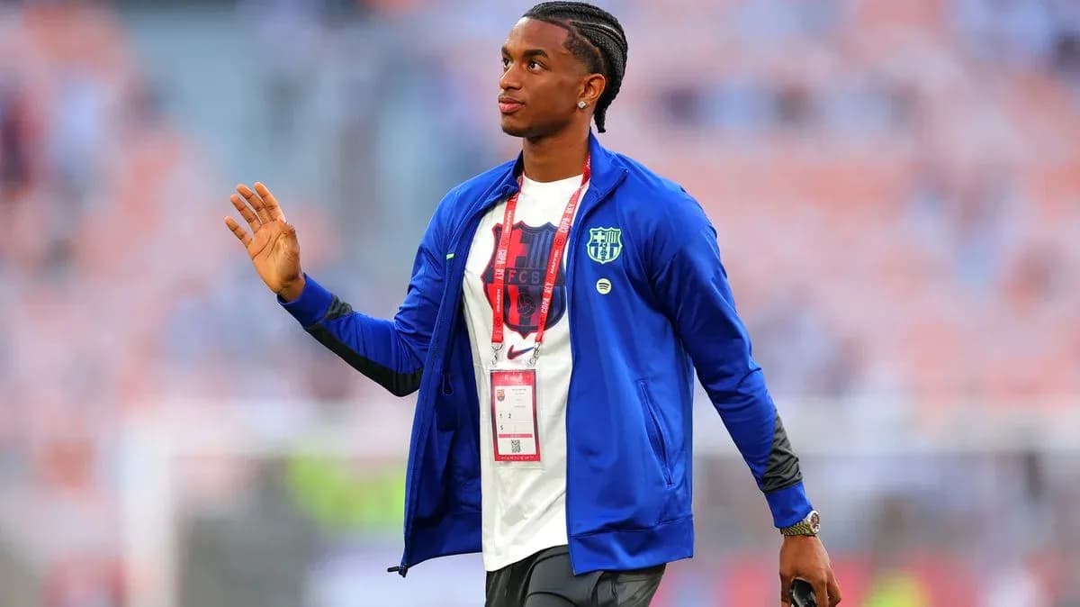 Player in FC Barcelona jacket greeting fans Player in FC Barcelona jacket greeting fans