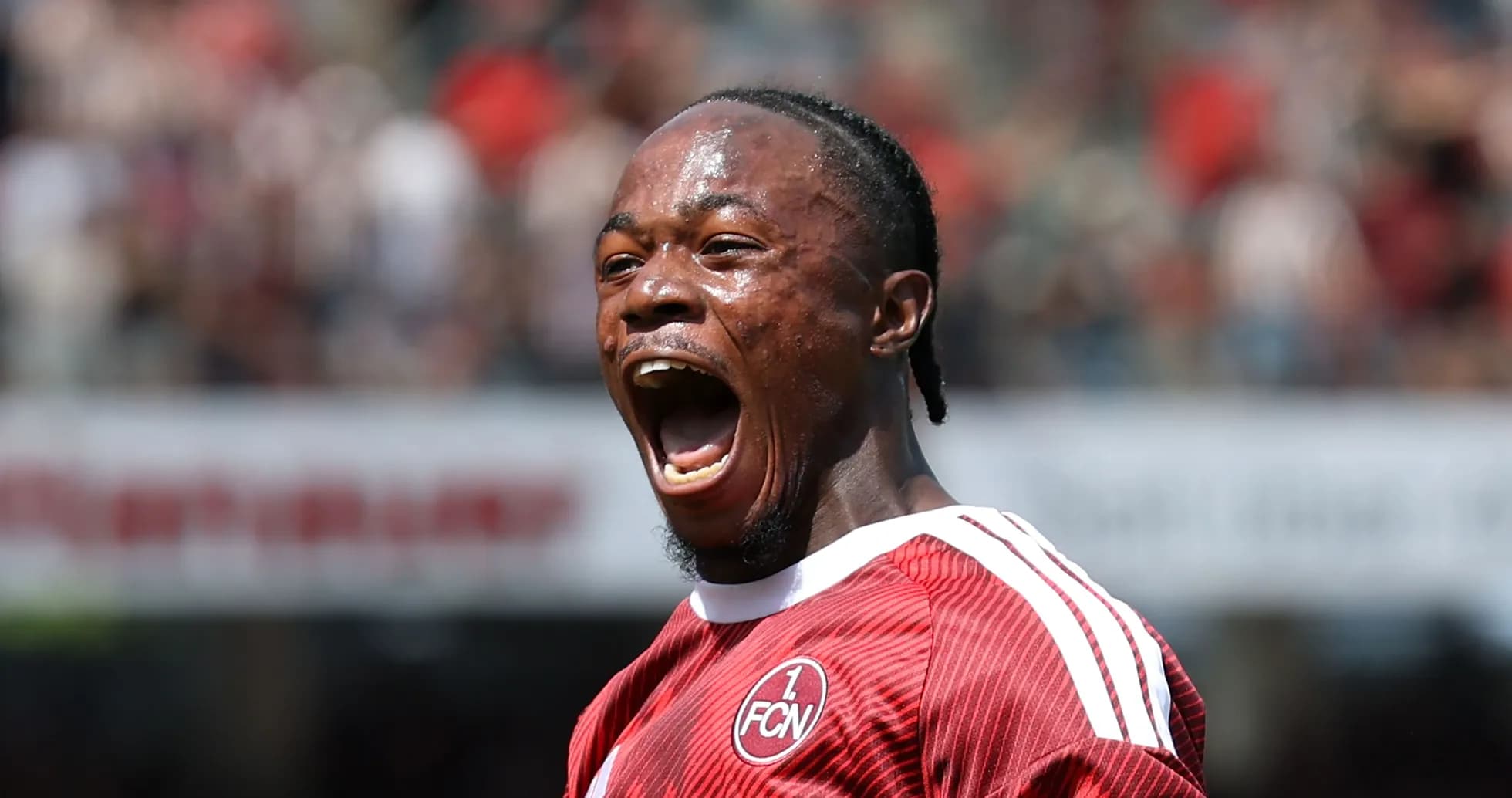 Player celebrating a goal in red team jersey Player celebrating a goal in red team jersey
