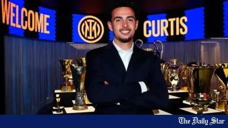 New player posing with trophies at club unveiling New player posing with trophies at club unveiling