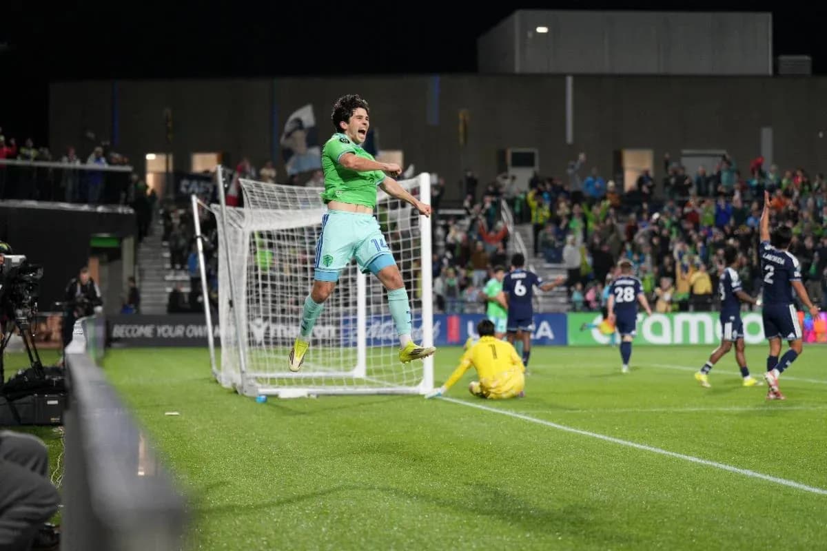 Player celebrating goal during Seattle Sounders match Player celebrating goal during Seattle Sounders match