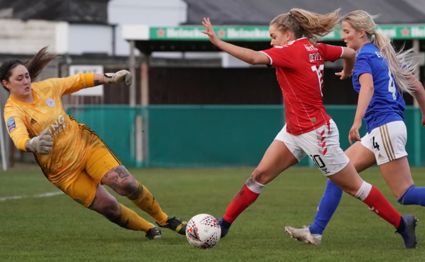 Goalkeeper attempting to save during match Goalkeeper attempting to save during match
