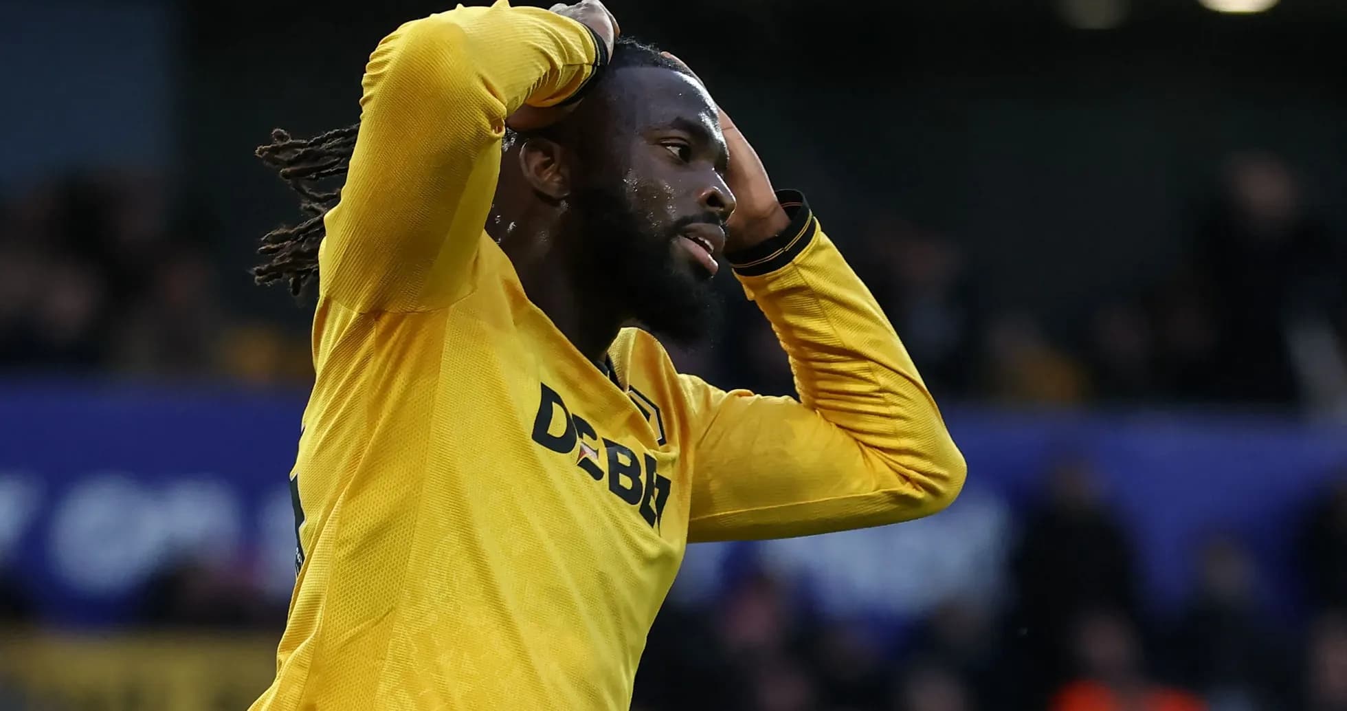 Player in yellow shirt expressing frustration on field Player in yellow shirt expressing frustration on field
