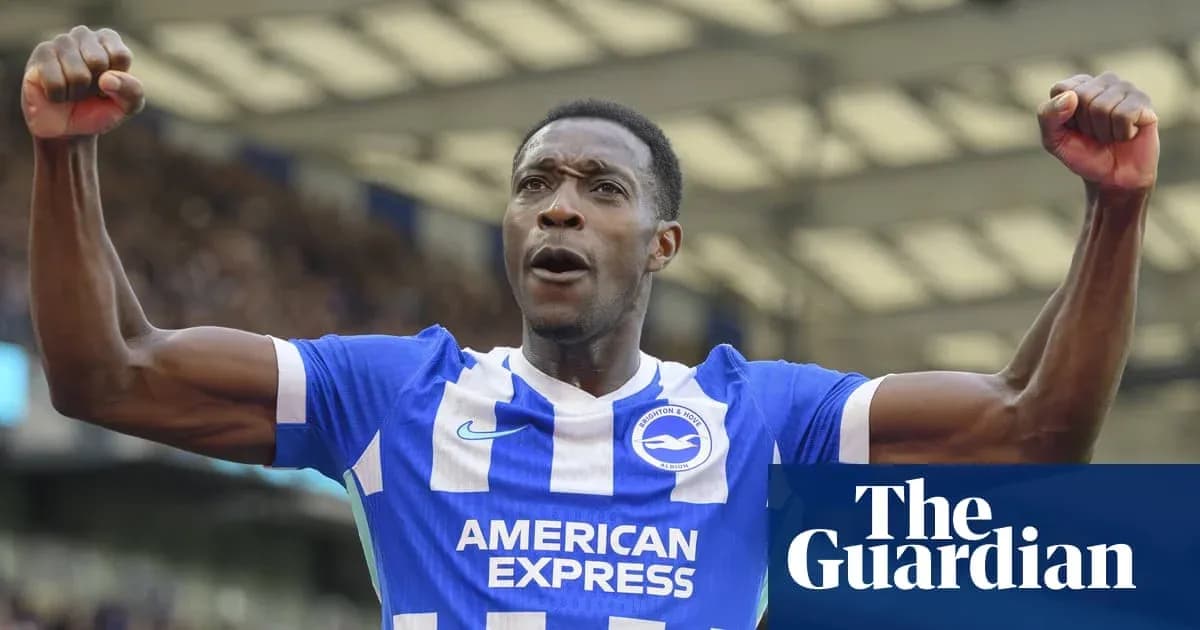 Football player celebrating in Brighton kit Football player celebrating in Brighton kit