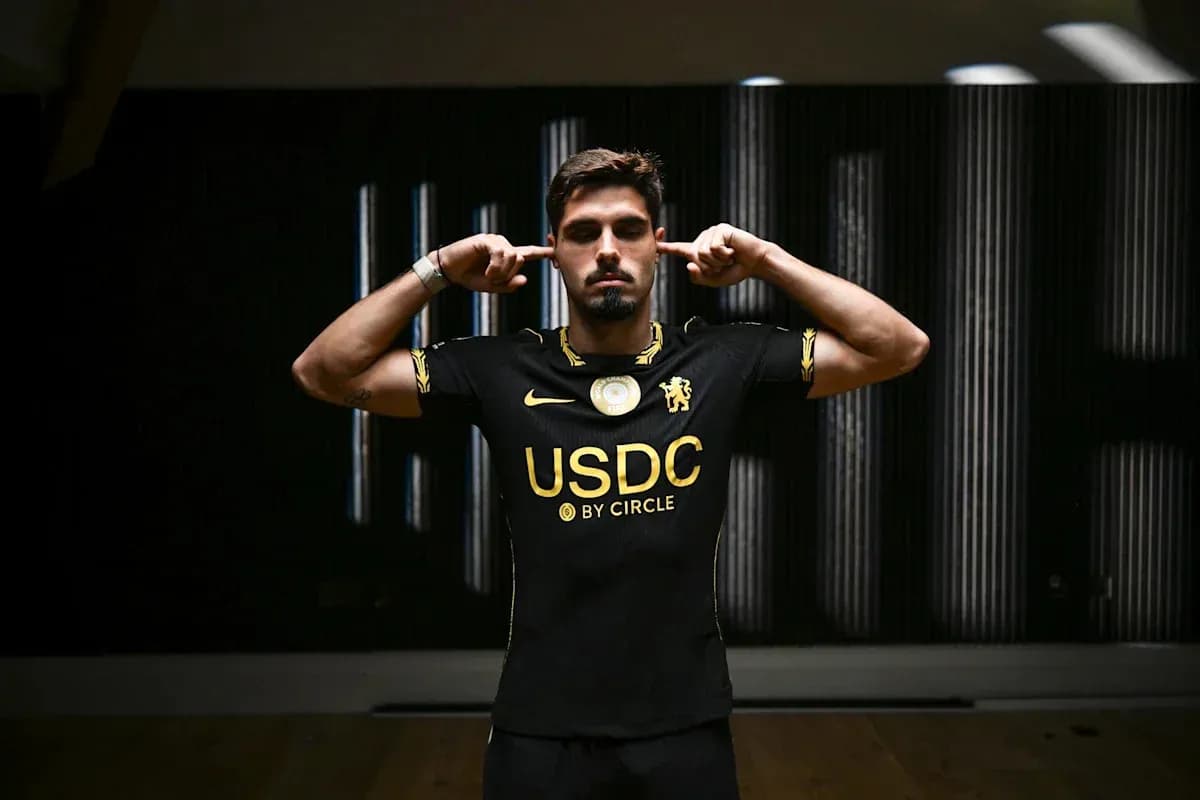 Player in black jersey blocking ears with hands Player in black jersey blocking ears with hands