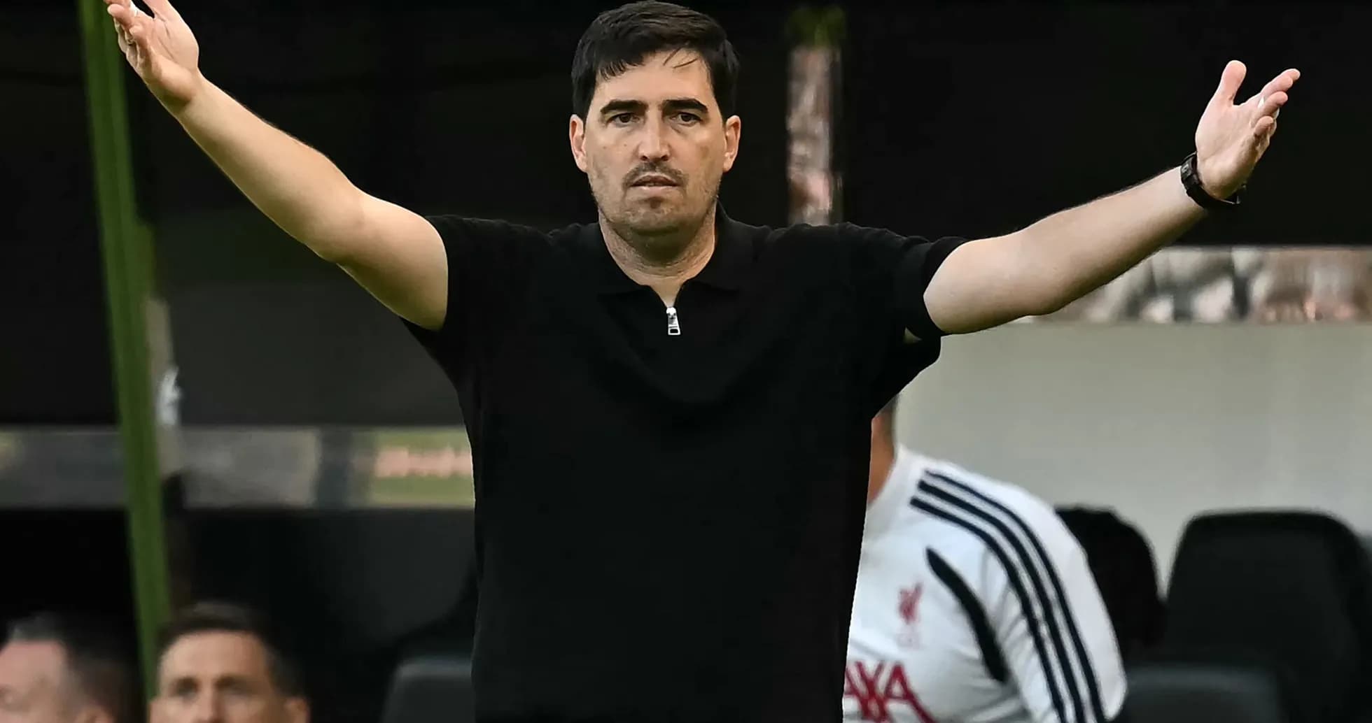 Coach gesturing from the sidelines during match Coach gesturing from the sidelines during match