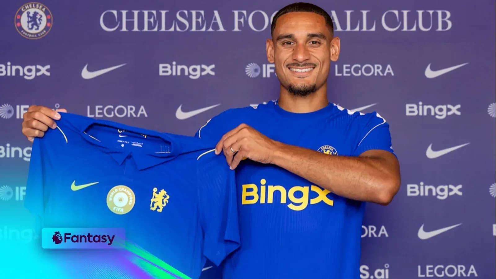 Player holding Chelsea FC jersey during signing event Player holding Chelsea FC jersey during signing event