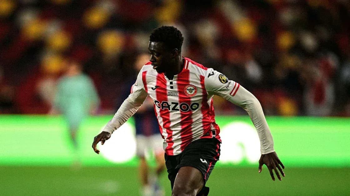 Brentford player running on the pitch during match Brentford player running on the pitch during match