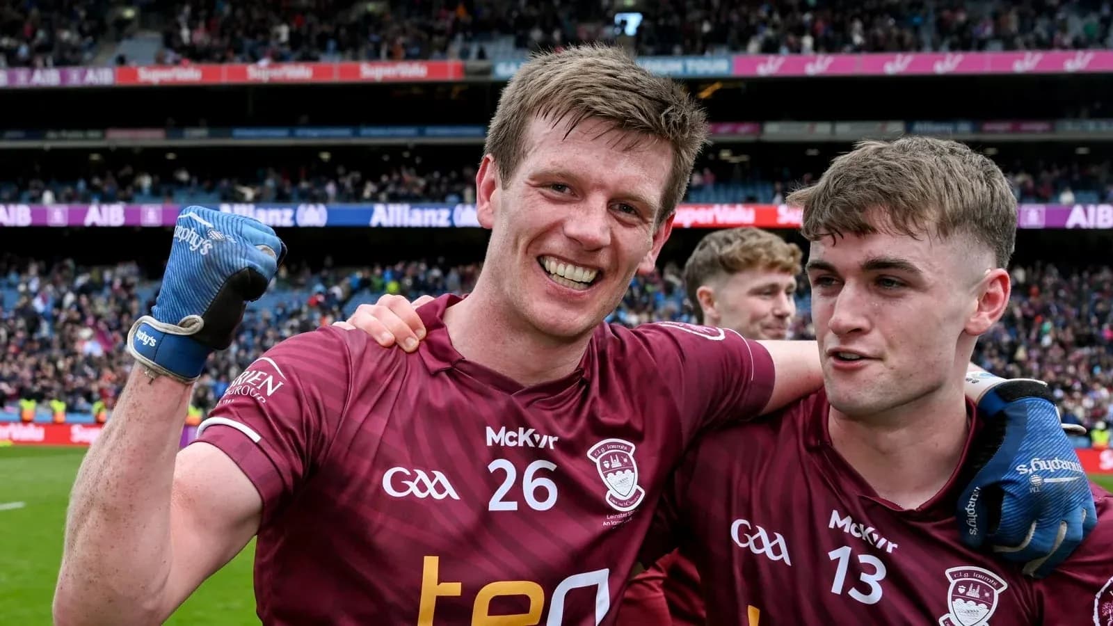 Two players celebrating after a match victory Two players celebrating after a match victory