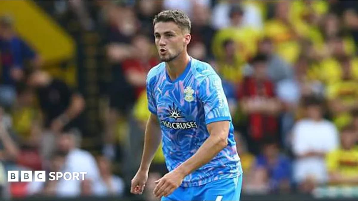 Player in blue jersey during match at stadium Player in blue jersey during match at stadium