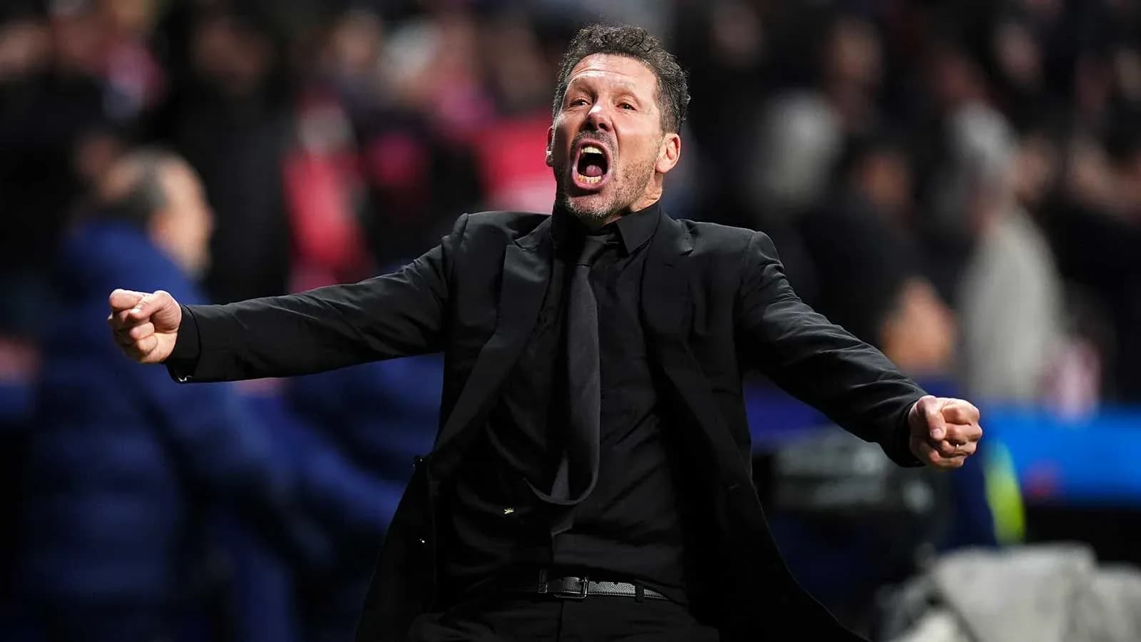 Coach celebrating passionately during a match Coach celebrating passionately during a match