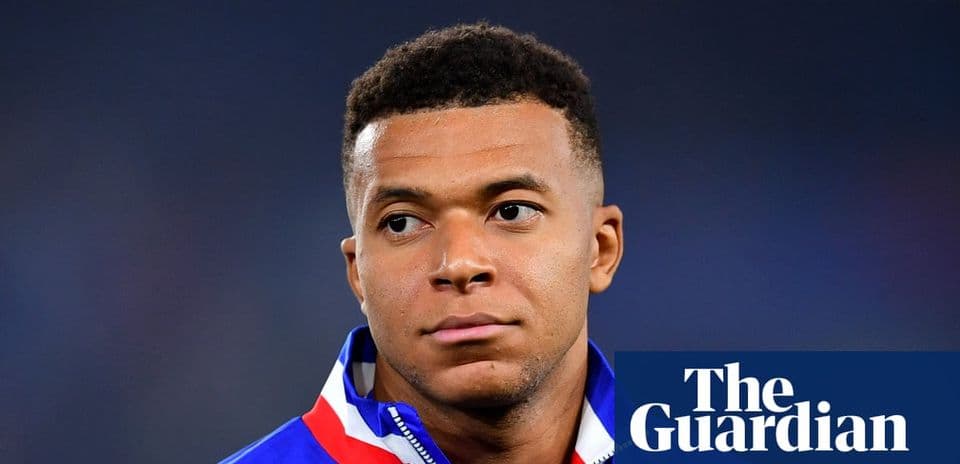 Player wearing national team jacket on field Player wearing national team jacket on field