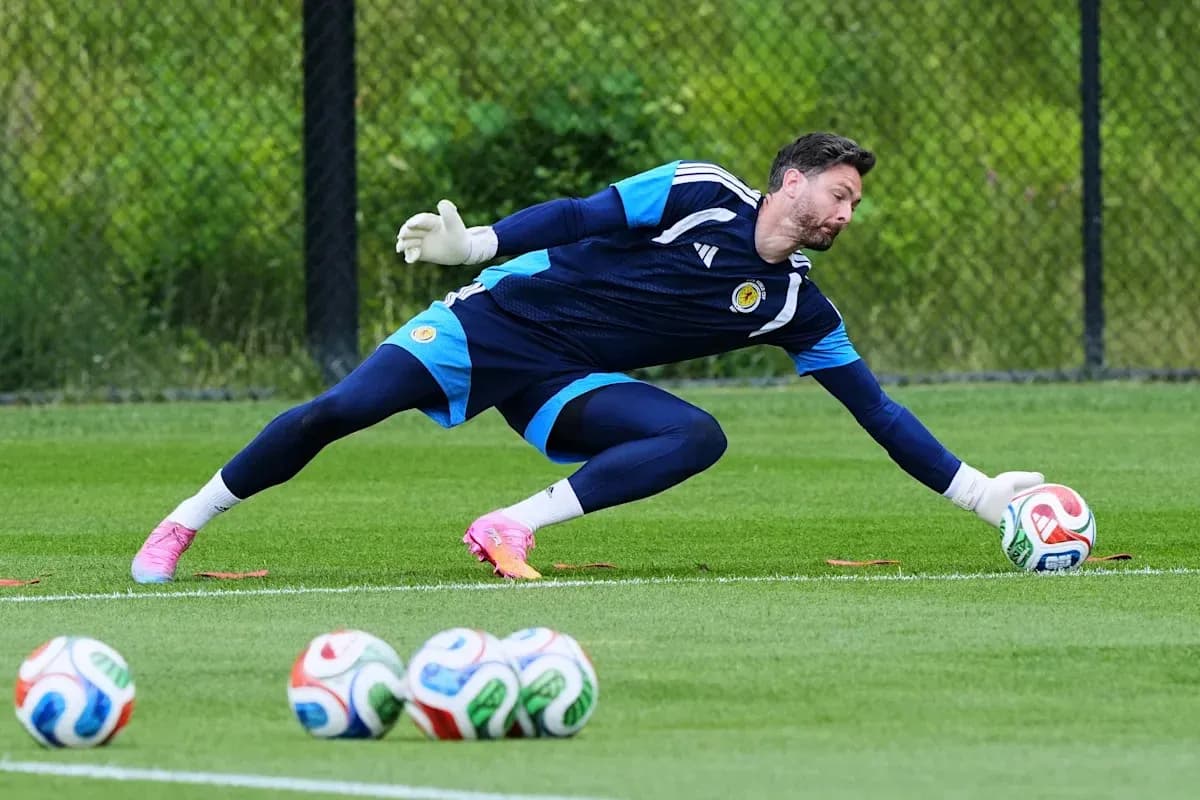 Goalkeeper diving to save a ball during training Goalkeeper diving to save a ball during training