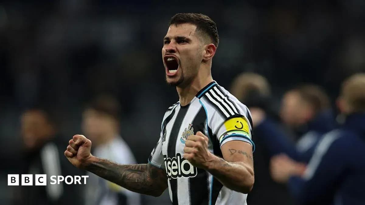 Newcastle player celebrating with clenched fists Newcastle player celebrating with clenched fists