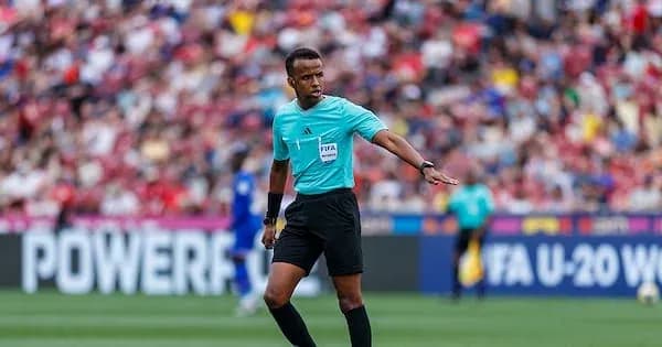 Referee officiating during a football match Referee officiating during a football match