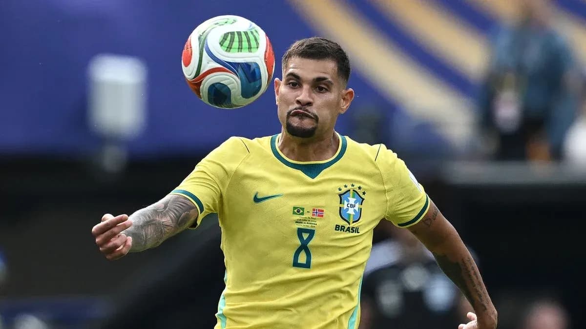 Brazilian player controlling a soccer ball during match Brazilian player controlling a soccer ball during match
