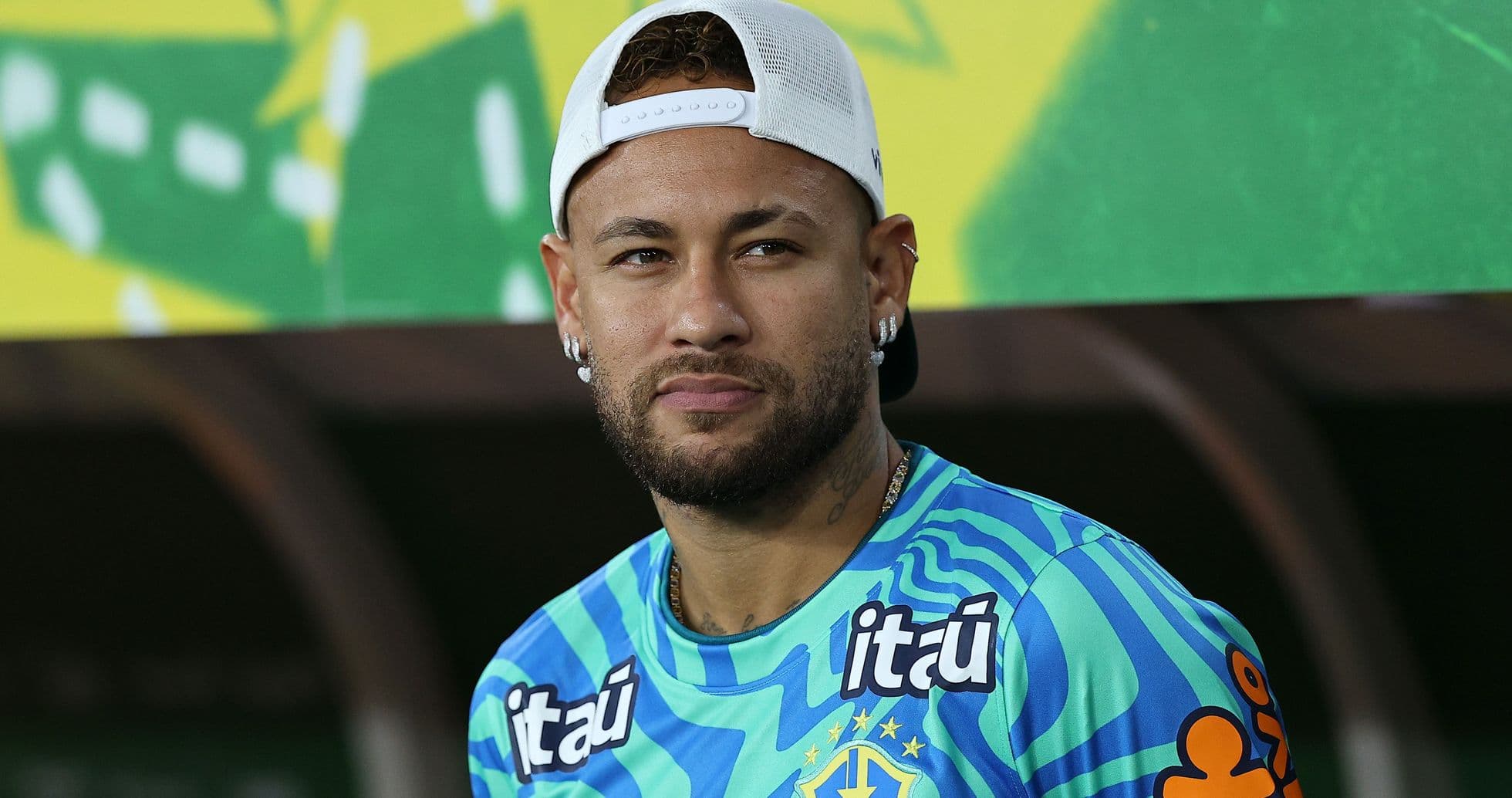 Football player in Brazil training kit at event Football player in Brazil training kit at event