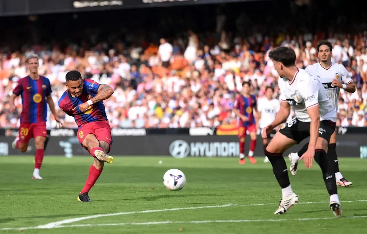 Barcelona player shooting on goal during match Barcelona player shooting on goal during match