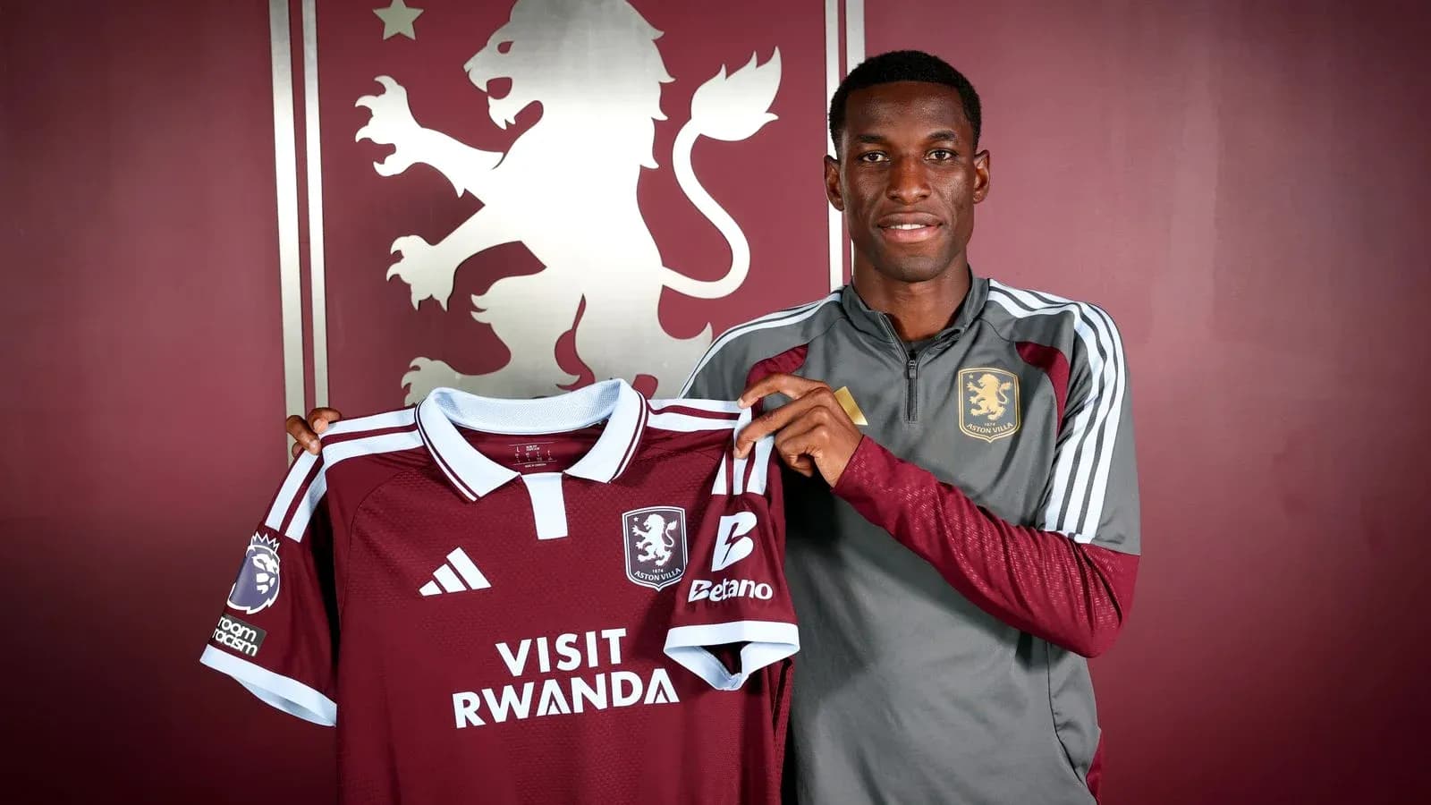 Player holding Aston Villa jersey during unveiling Player holding Aston Villa jersey during unveiling