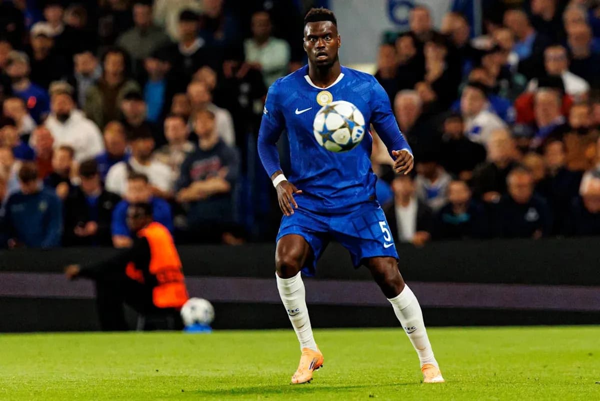 Player in blue jersey controlling the ball on field Player in blue jersey controlling the ball on field