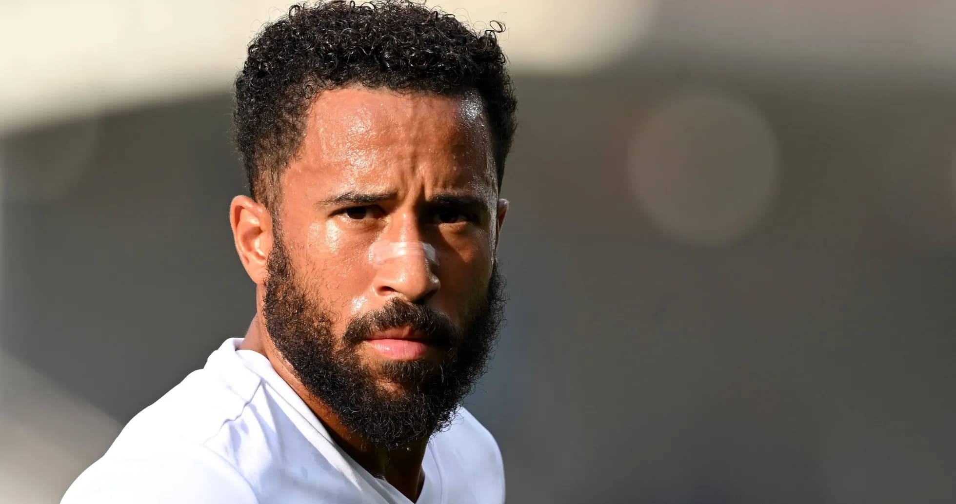 Player with a beard and bandage on nose Player with a beard and bandage on nose