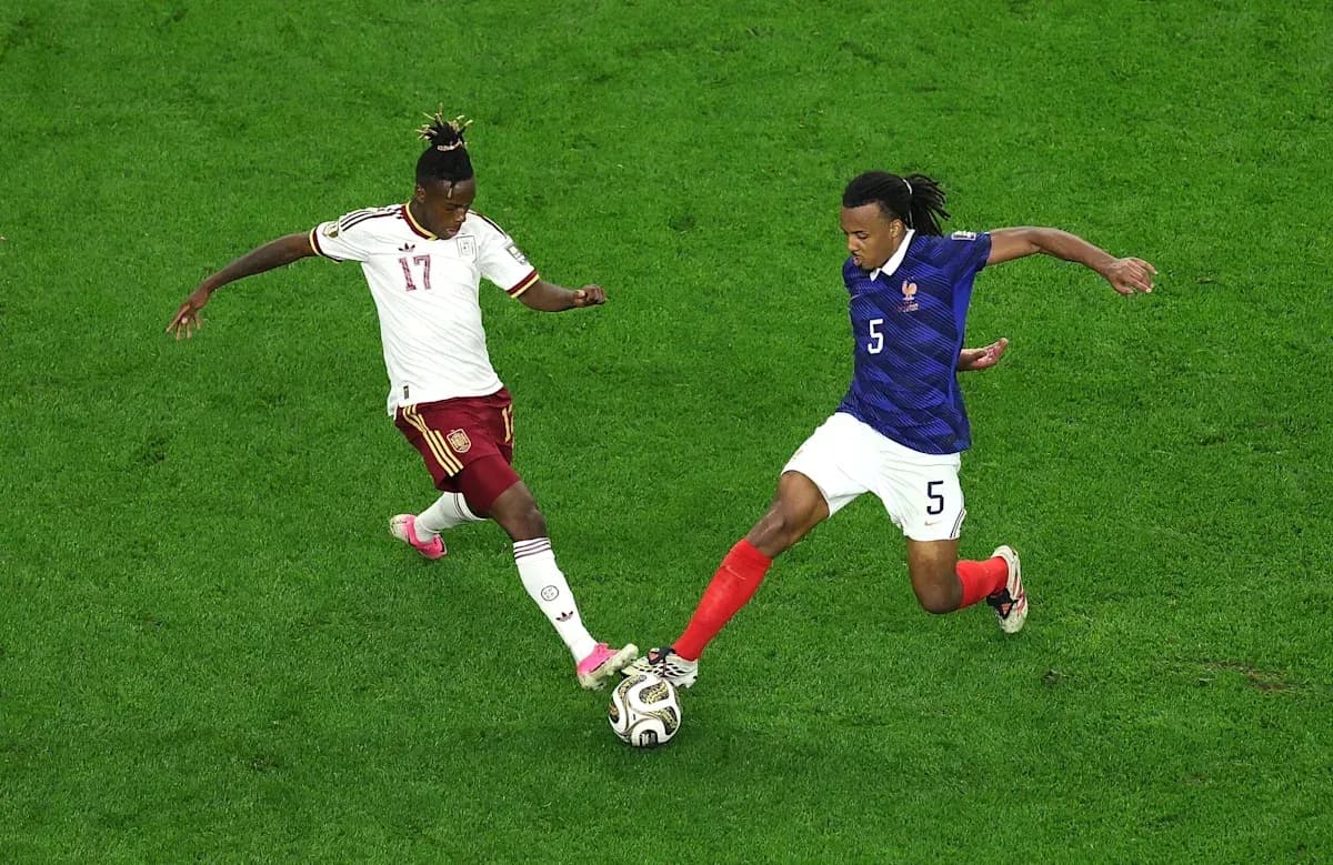 Two players contesting the ball during match Two players contesting the ball during match