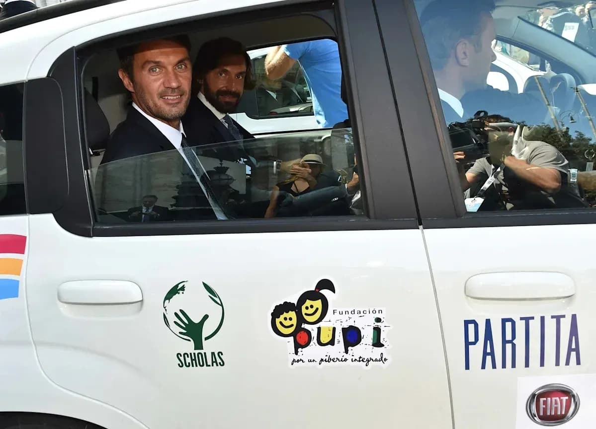 Two men in suits sitting in a car Two men in suits sitting in a car
