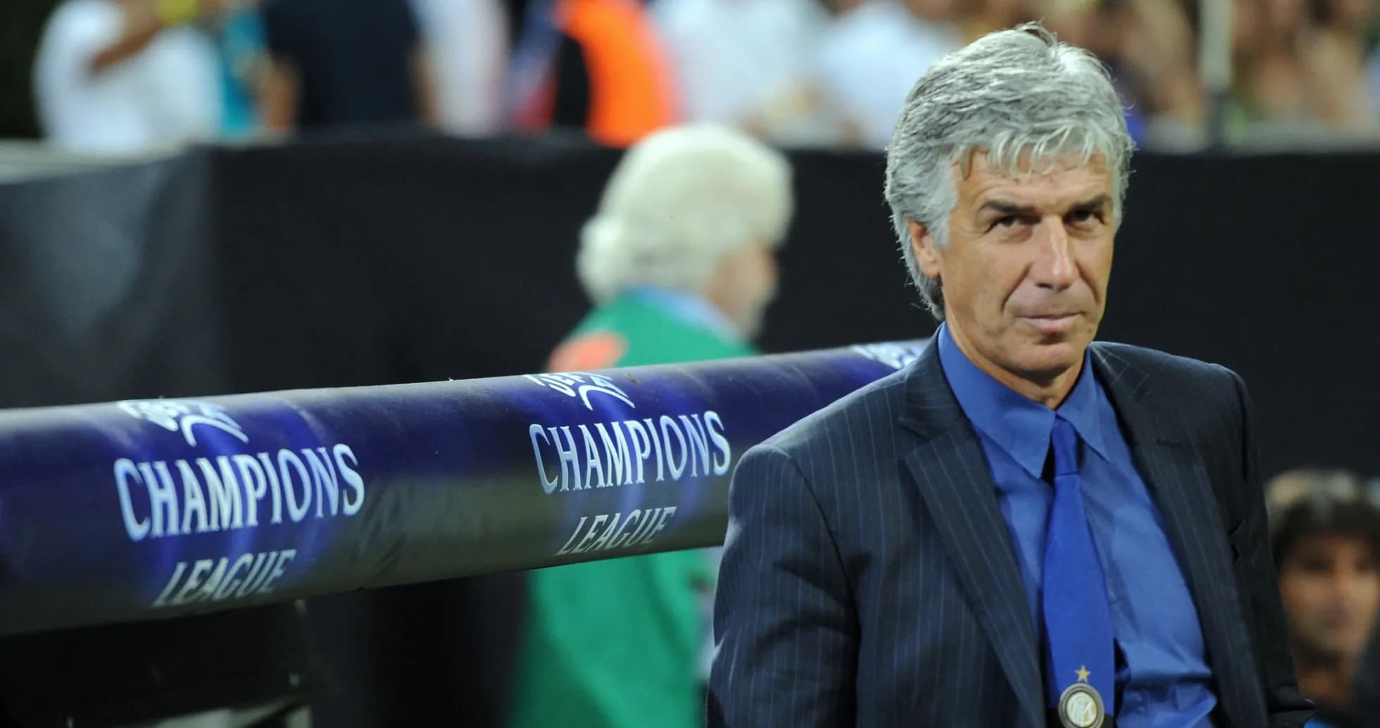 Coach sitting near Champions League bench during match Coach sitting near Champions League bench during match