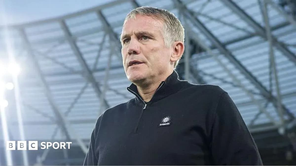 Manager at stadium during press conference Manager at stadium during press conference