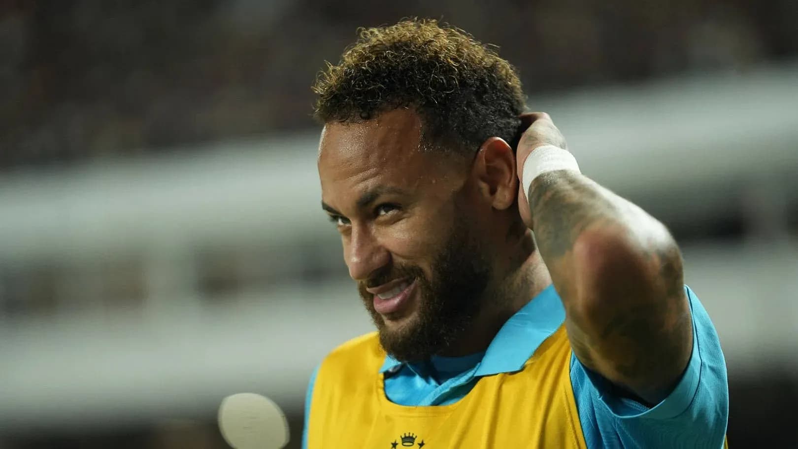 Neymar adjusting his hair during warm-up session Neymar adjusting his hair during warm-up session