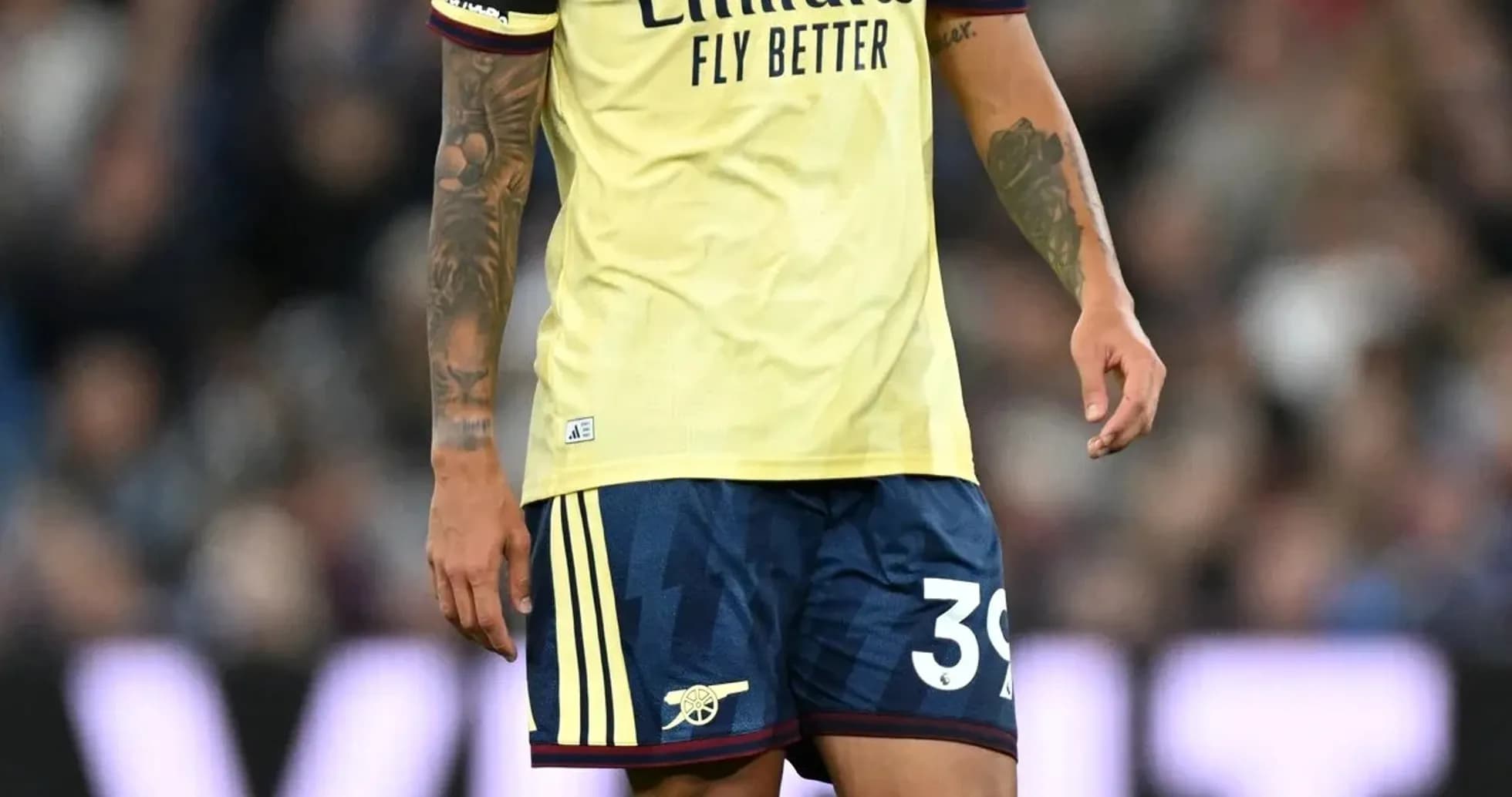 Player wearing Arsenal kit on the pitch Player wearing Arsenal kit on the pitch