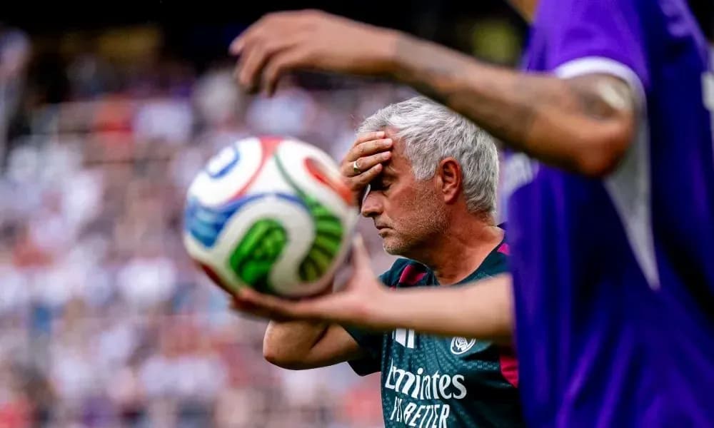 Manager with hand on forehead during match Manager with hand on forehead during match