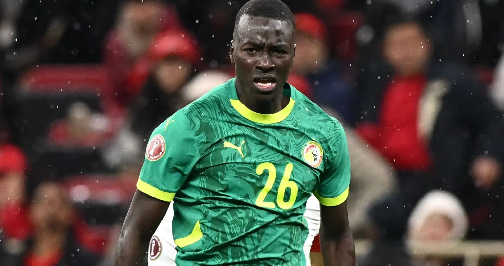 Player wearing Senegal jersey during match action Player wearing Senegal jersey during match action