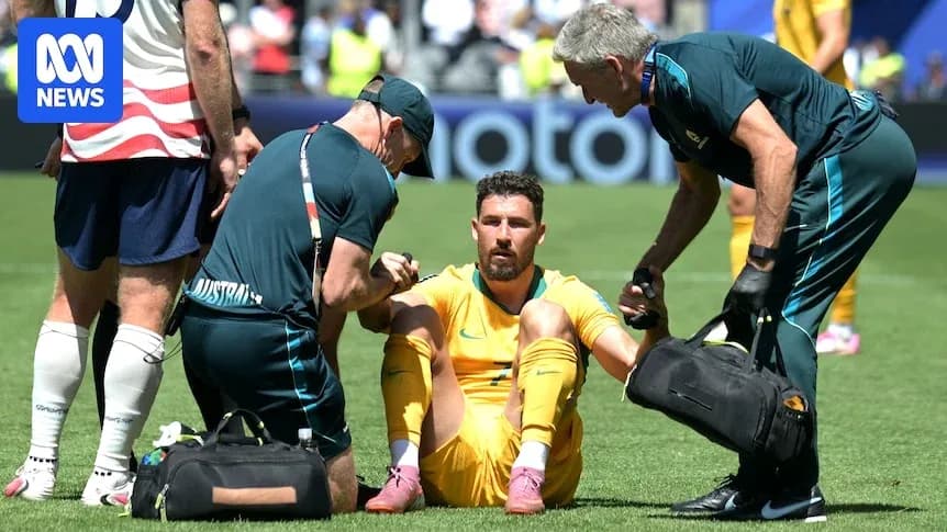 Player receiving medical attention on the field Player receiving medical attention on the field