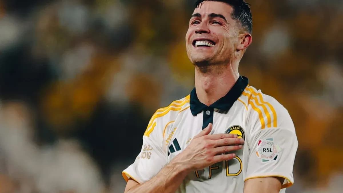 Player celebrating with a smile after match Player celebrating with a smile after match