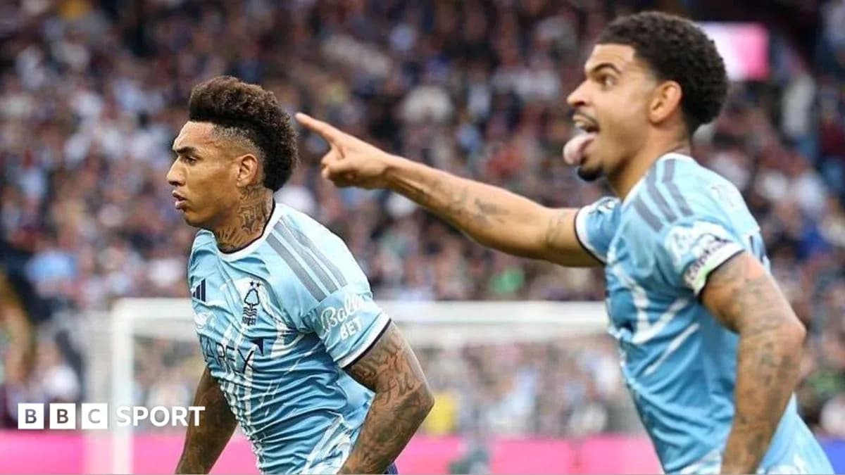 Two players celebrating a goal on the pitch Two players celebrating a goal on the pitch