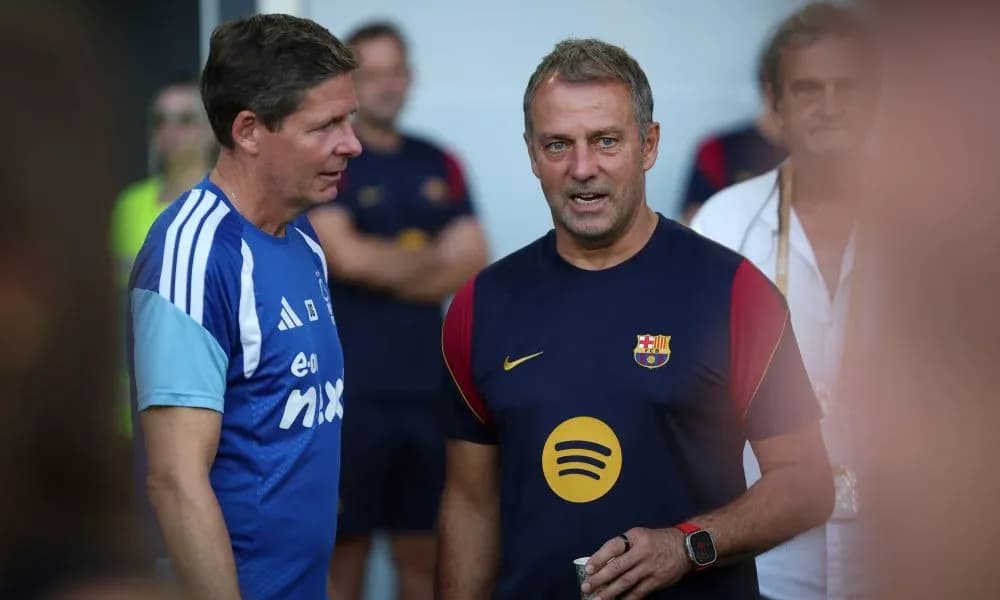 Coaches talking during Barcelona training session Coaches talking during Barcelona training session