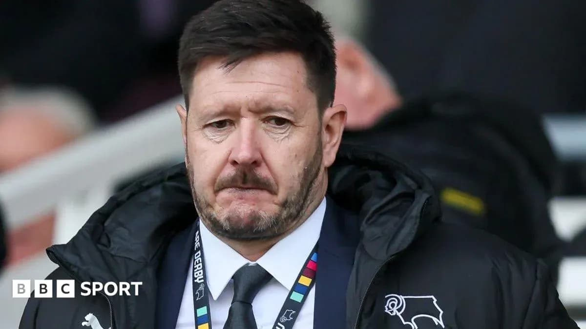 Manager in Derby County jacket on sidelines Manager in Derby County jacket on sidelines