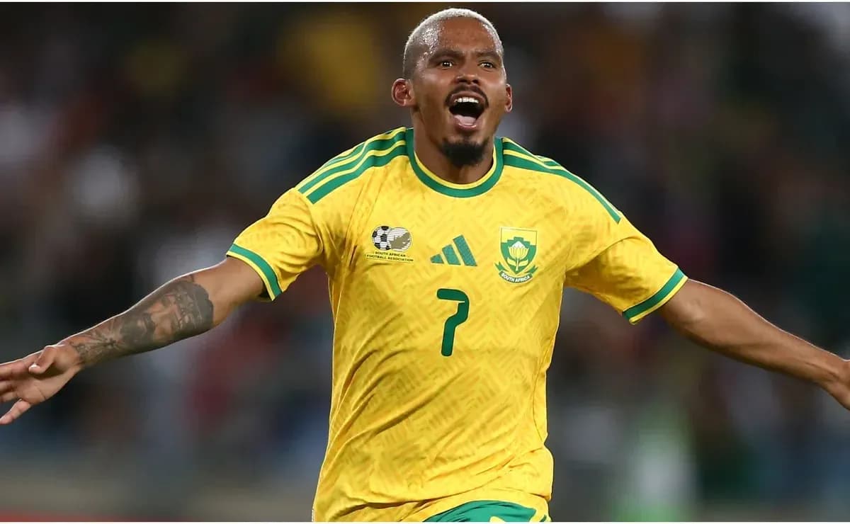 Player celebrating a goal in yellow jersey Player celebrating a goal in yellow jersey