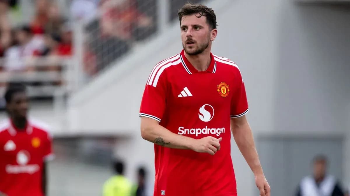Player in red Manchester United kit on field Player in red Manchester United kit on field