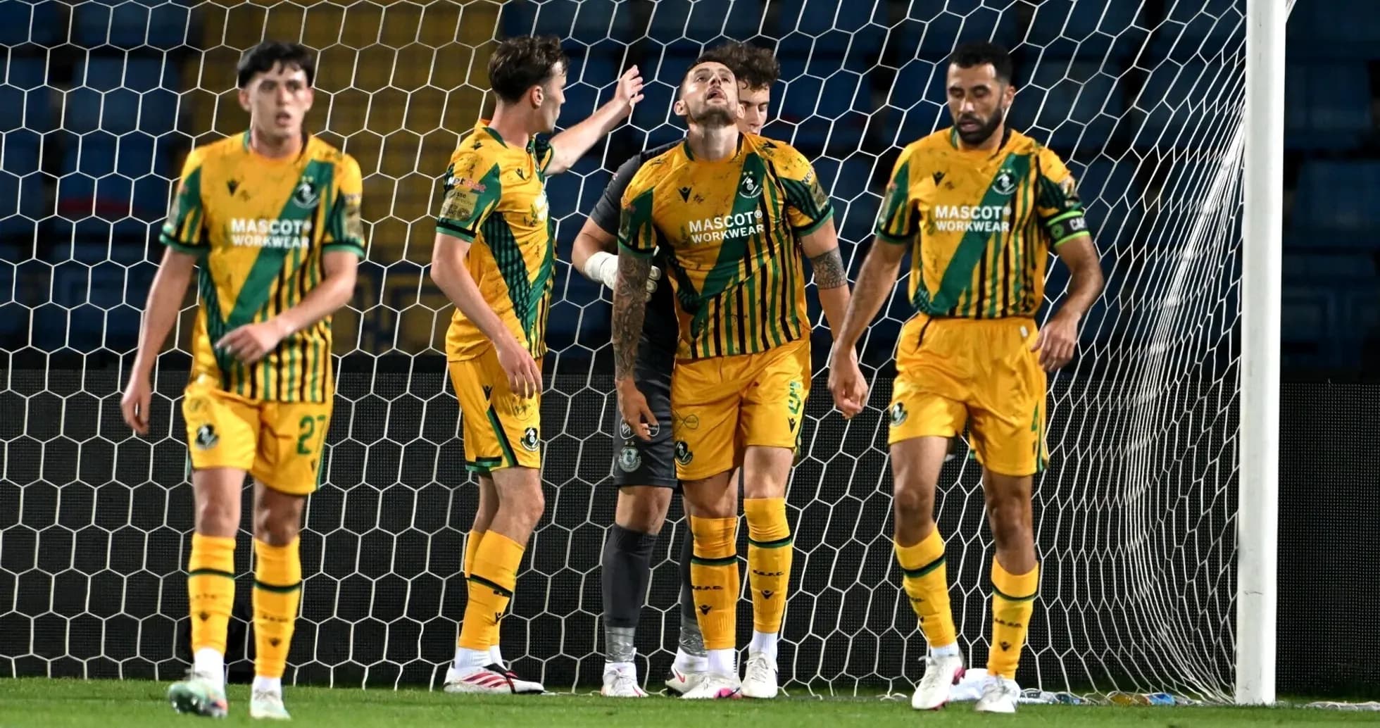 Shamrock Rovers players celebrating near goal Shamrock Rovers players celebrating near goal