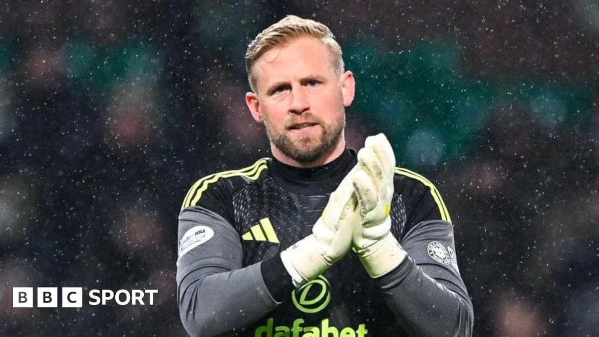 Goalkeeper applauding fans during snowy match Goalkeeper applauding fans during snowy match