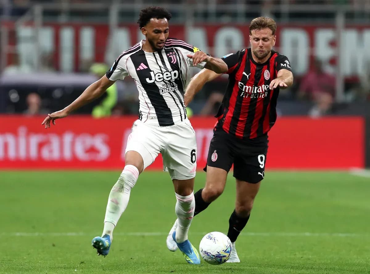 Juventus player dribbling past AC Milan opponent Juventus player dribbling past AC Milan opponent