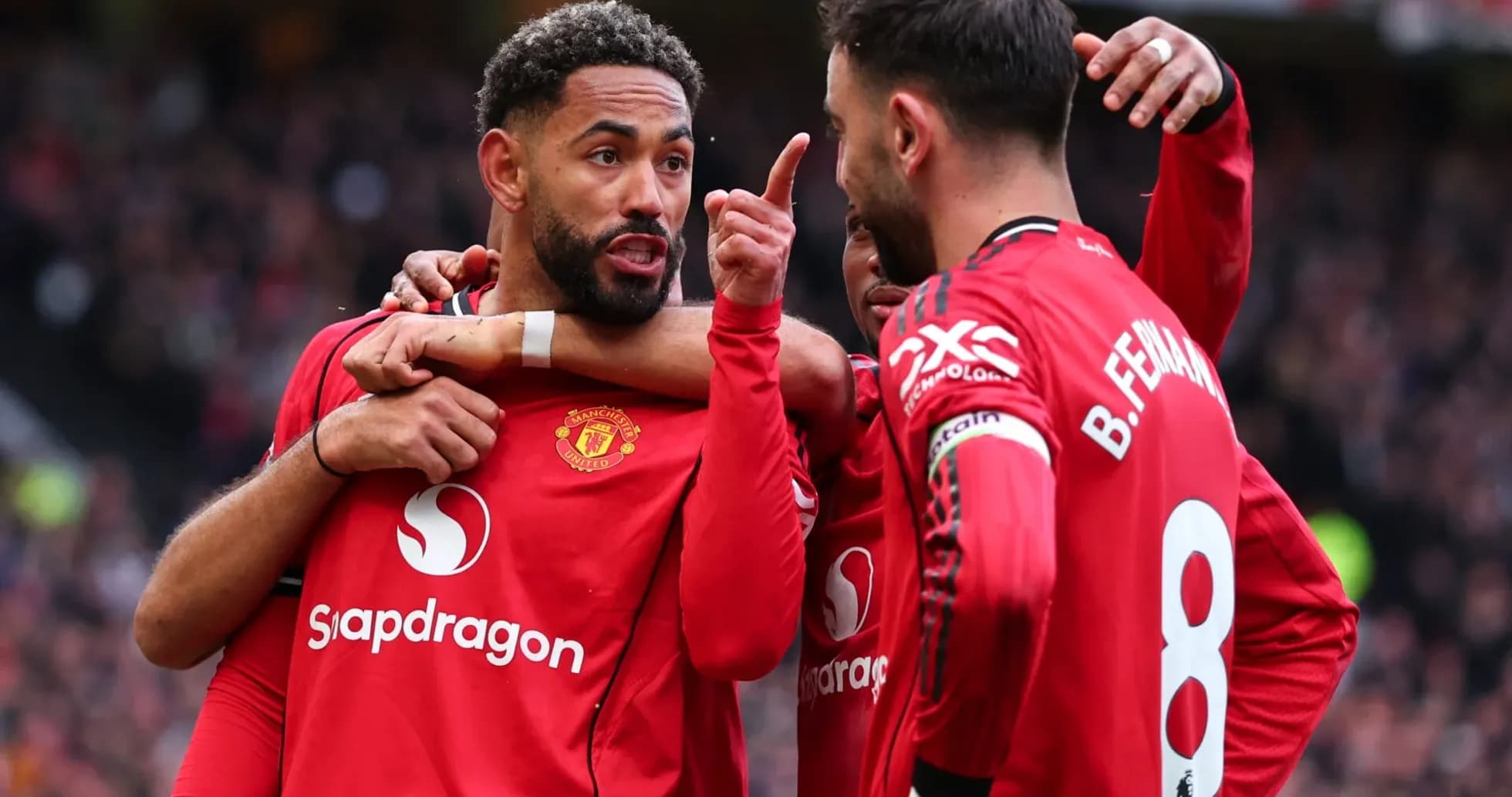 Manchester United players celebrating a goal together Manchester United players celebrating a goal together