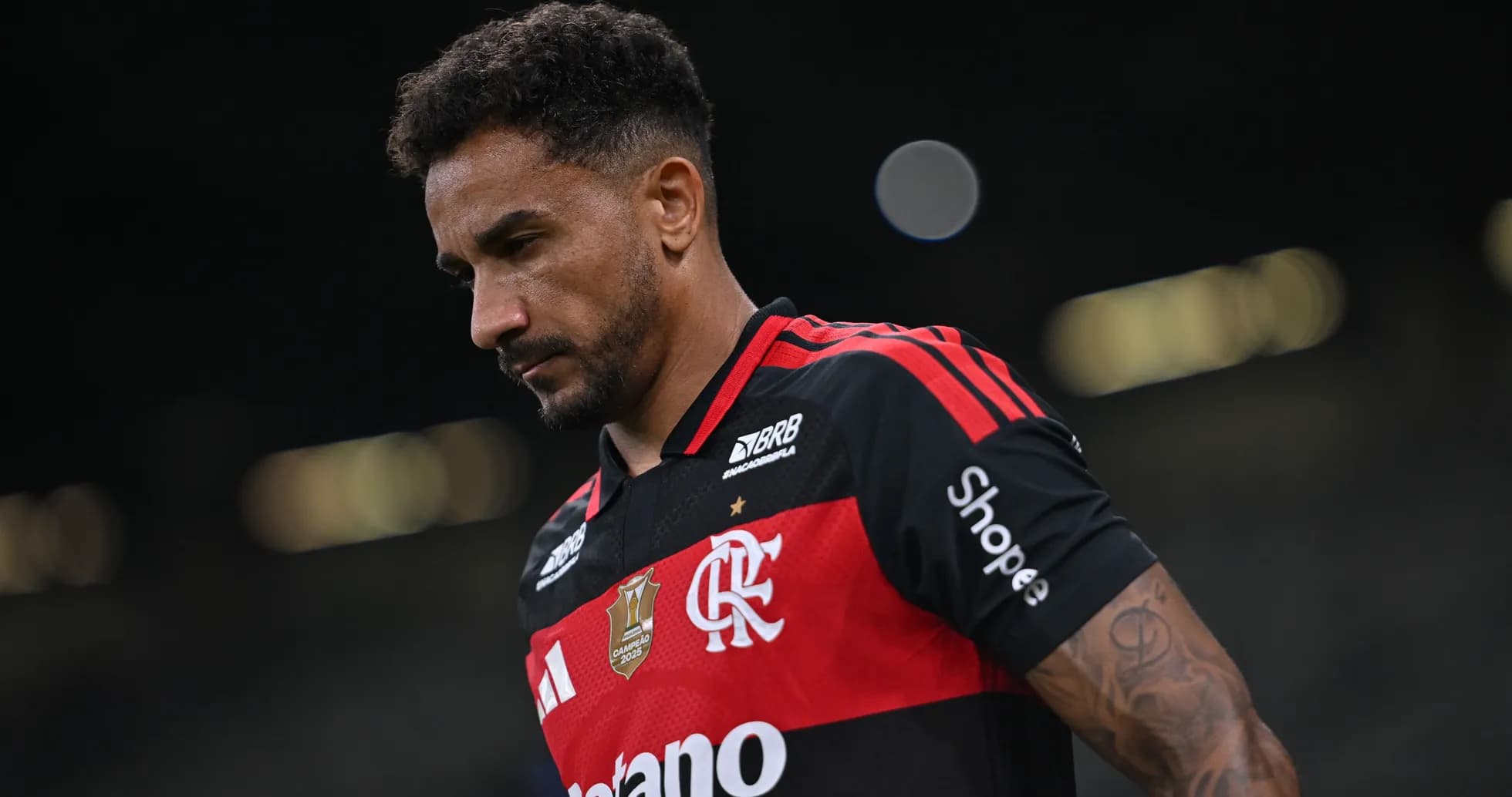 Player in Flamengo jersey walking on the field Player in Flamengo jersey walking on the field
