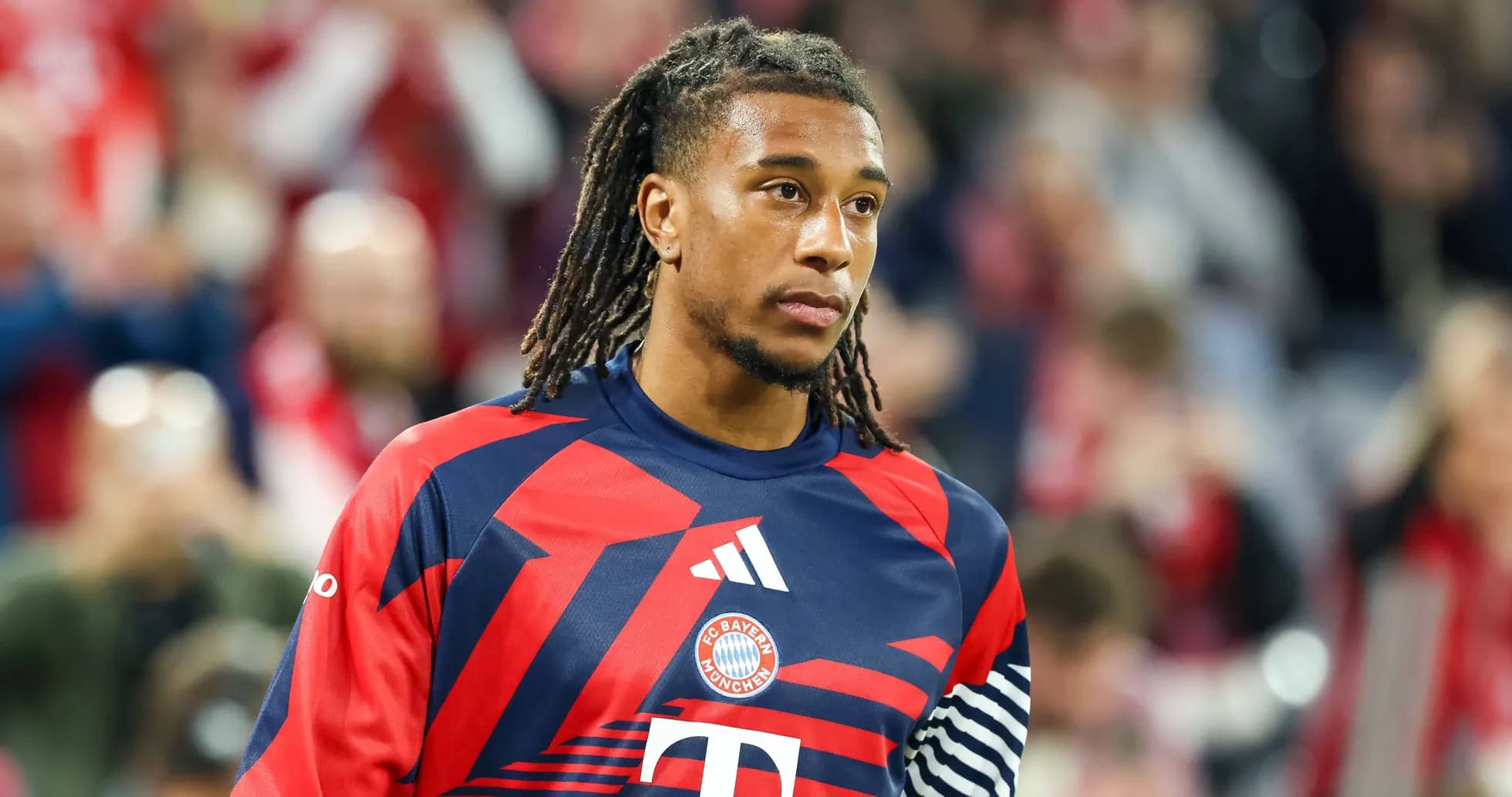 Player in Bayern Munich jersey walking on field Player in Bayern Munich jersey walking on field