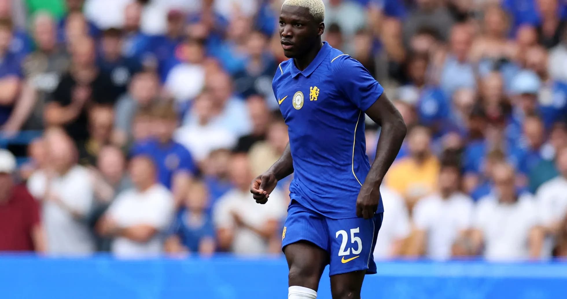 Player wearing Chelsea kit during match on field Player wearing Chelsea kit during match on field