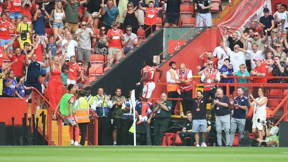 Fans celebrating as player scores a goal Fans celebrating as player scores a goal