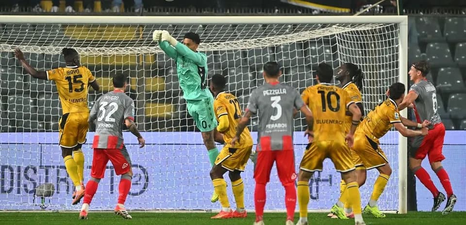 Goalkeeper catching ball during Udinese vs Cremonese match Goalkeeper catching ball during Udinese vs Cremonese match