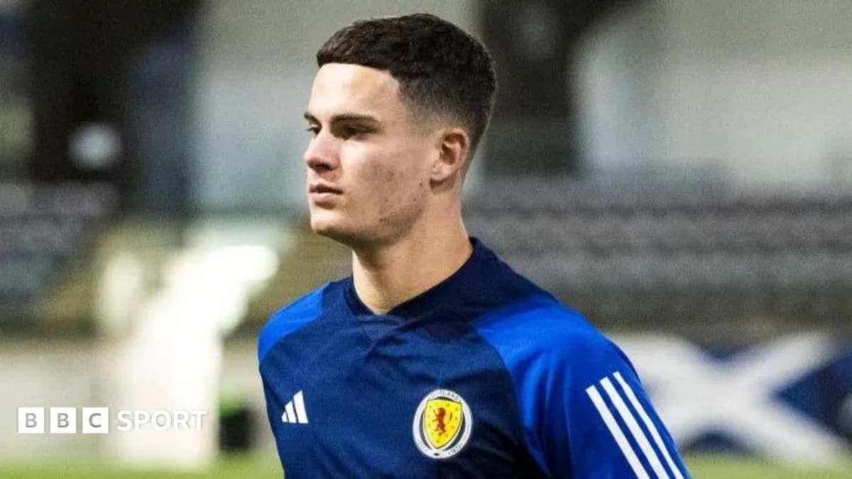 Player in Scotland training kit on the pitch Player in Scotland training kit on the pitch