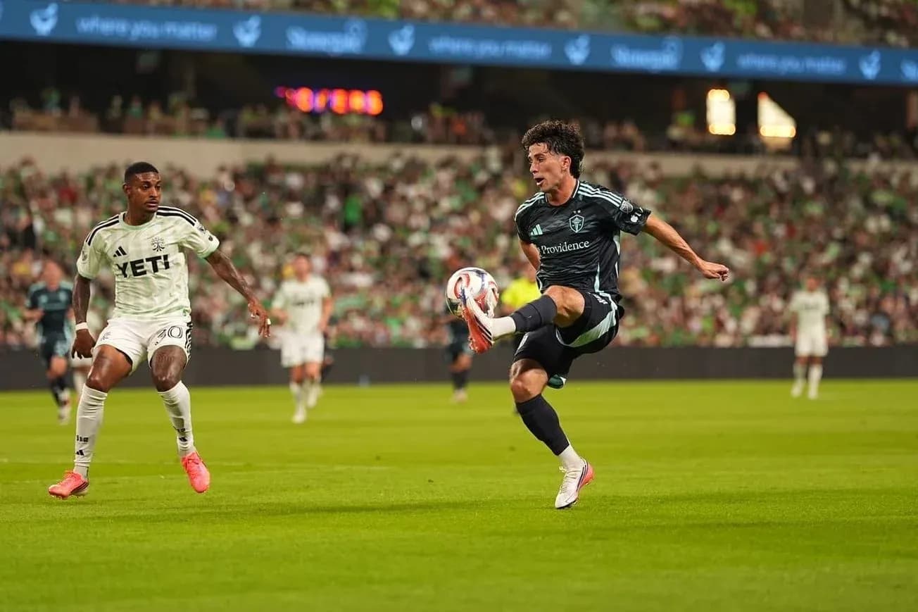 Player kicking the ball in MLS match Player kicking the ball in MLS match